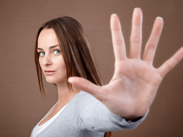 Woman giving hand stop sign